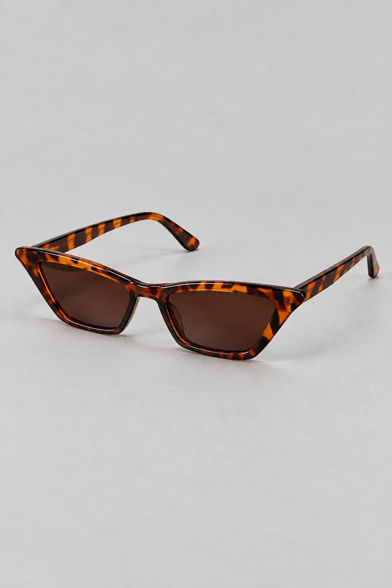 Lunettes Léopard Années 2000 — seules sur fond gris studio