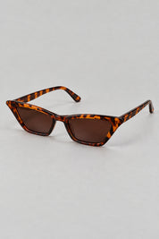 Lunettes Léopard Années 2000 — seules sur fond gris studio