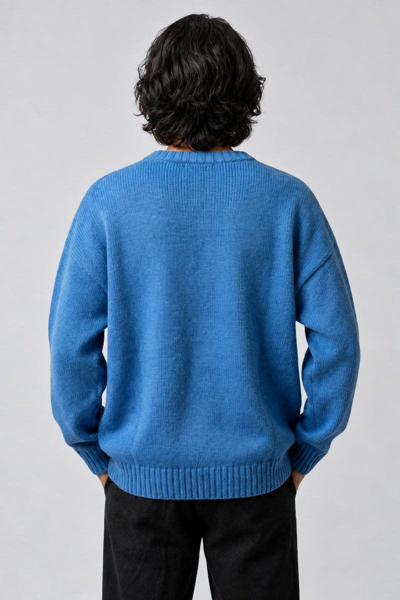 Pull Géométrique Oversize, porté de dos sur fond gris clair