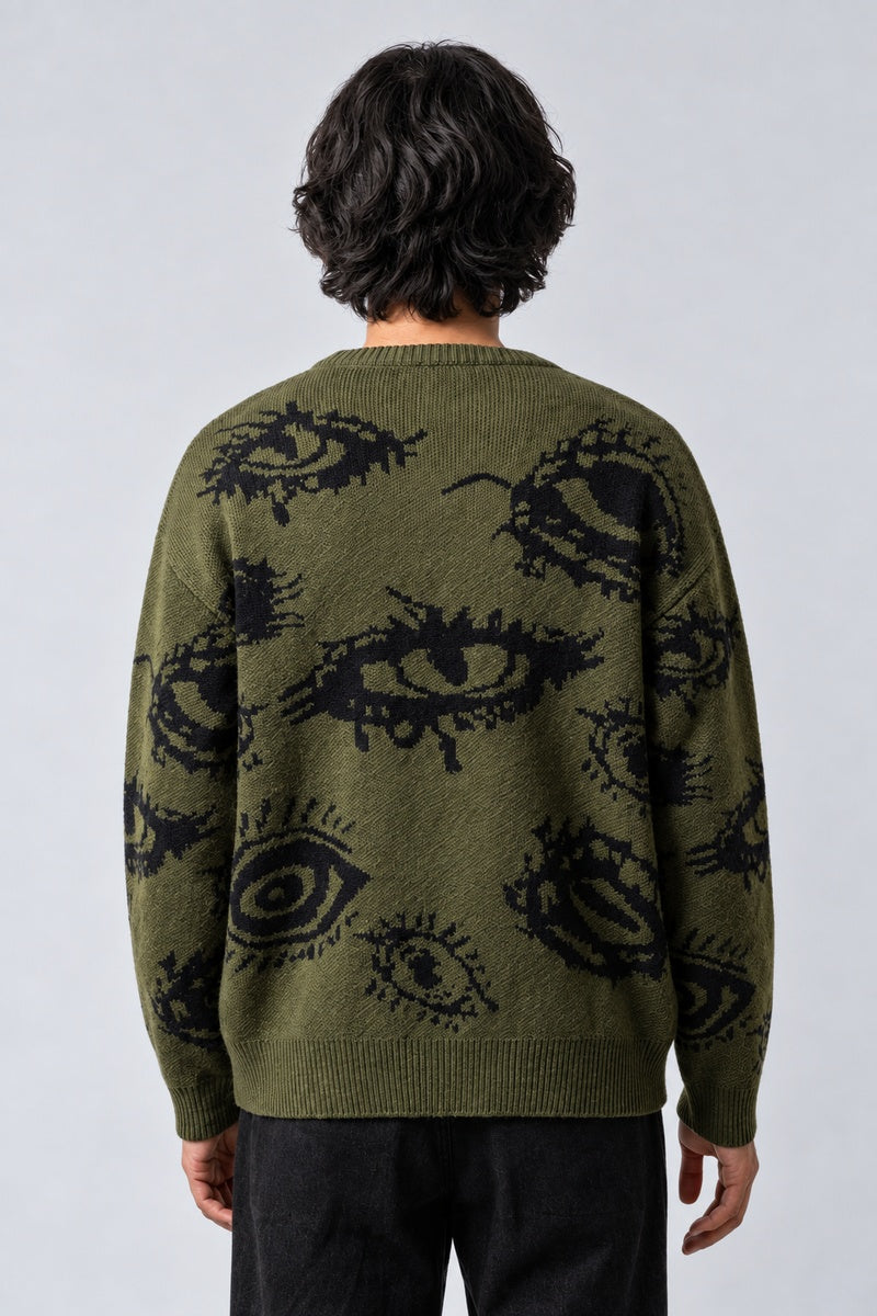 Pull Œil Abstrait, porté de dos sur fond gris clair