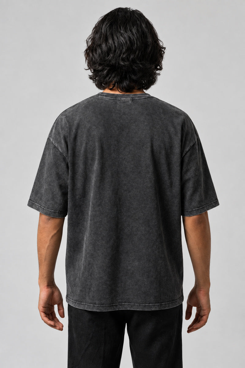 Dos uni du t-shirt Krull gris délavé, porté par un homme.