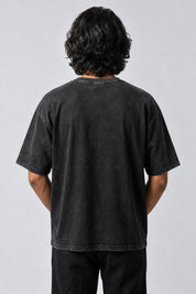 Dos uni du t-shirt noir délavé No Risk No Story, porté par un homme.